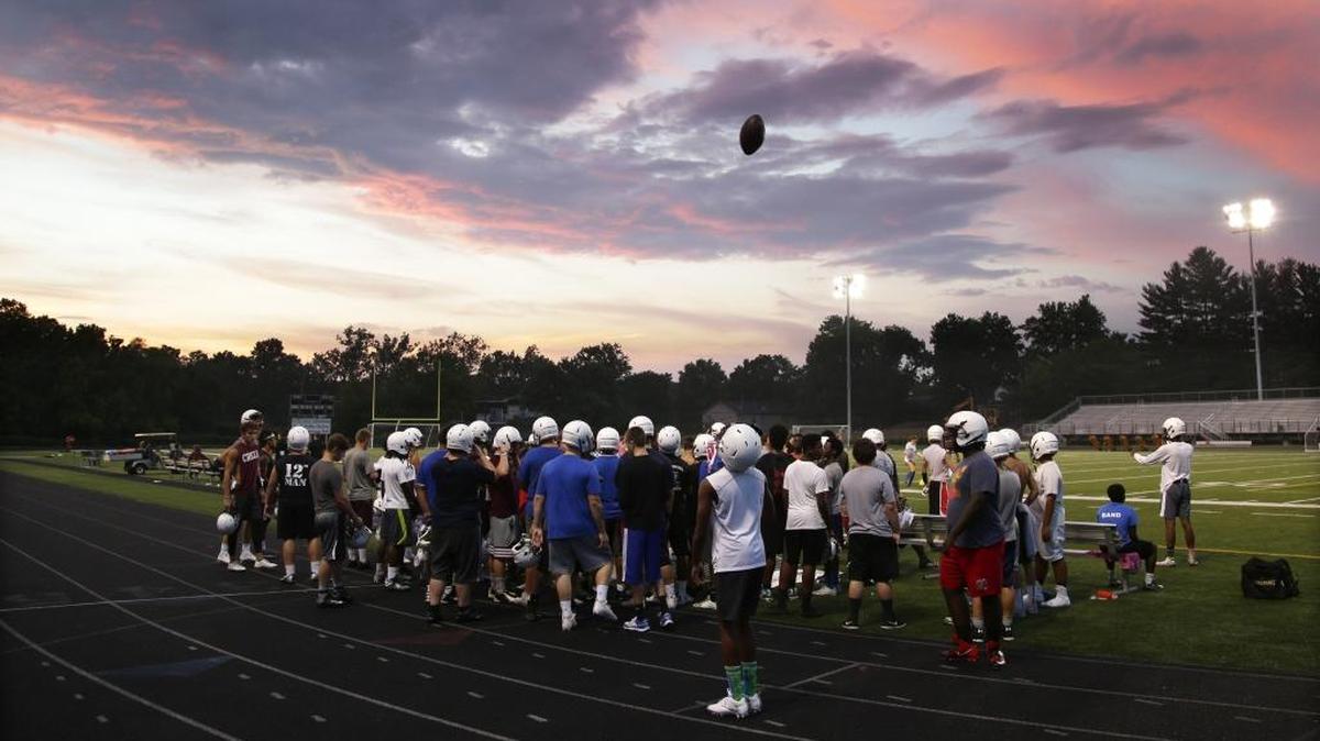 Pre-practice huddle as the Tates Creek football team took advantage of cooler evening temperatures for practice on Wednesday July 20, 2016 in Lexington, Ky.