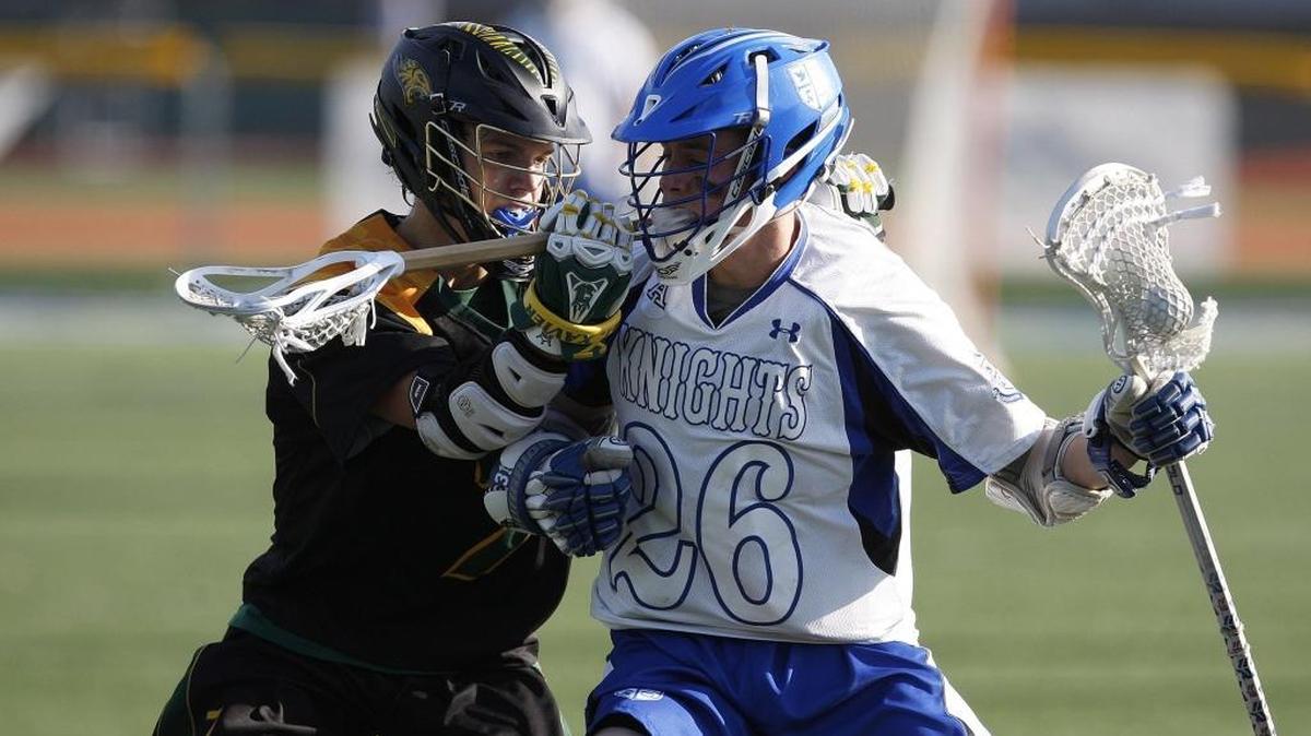 LexCath’s Benjamin Barberie is guarded by St. Xavier’s Harrison Pate at Lexington Catholic's field in Lexington, Ky., April 28, 2016.