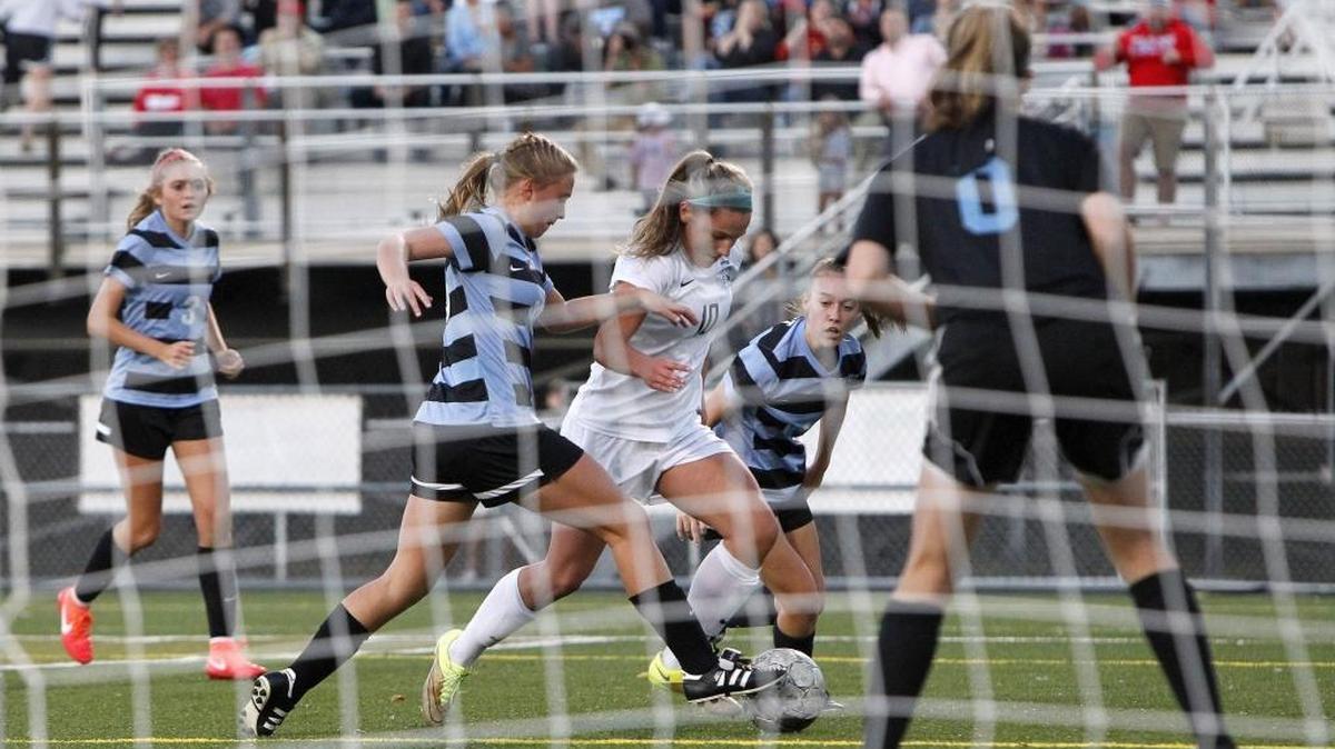 Sacred Heart's Cassie Amshoff works toward a shot on goal against West Jessamine during the KHSAA state quarterfinals at Jon R. Akers Stadium in Lexington, Ky., Saturday, October 29, 2016.