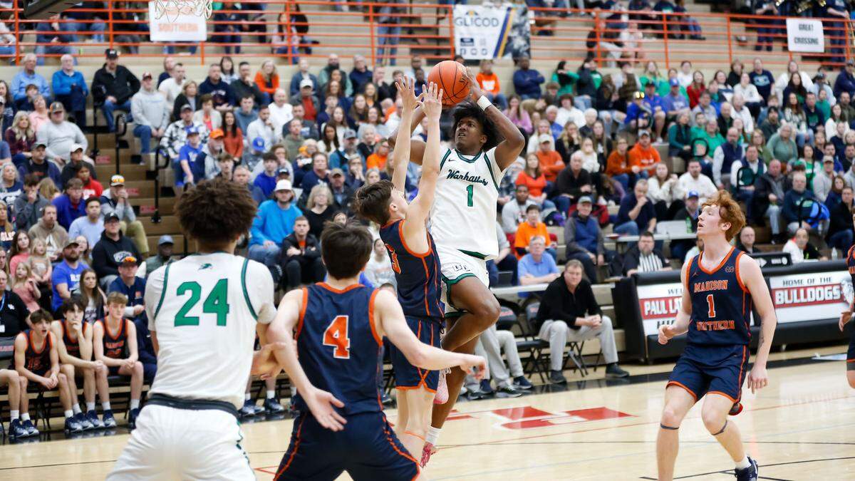 Great Crossing’s Vince Dawson (1) went up for a shot in the lane against Madison Southern during the boys 11th Region Tournament semifinals at Paul Laurence Dunbar High School on Saturday.