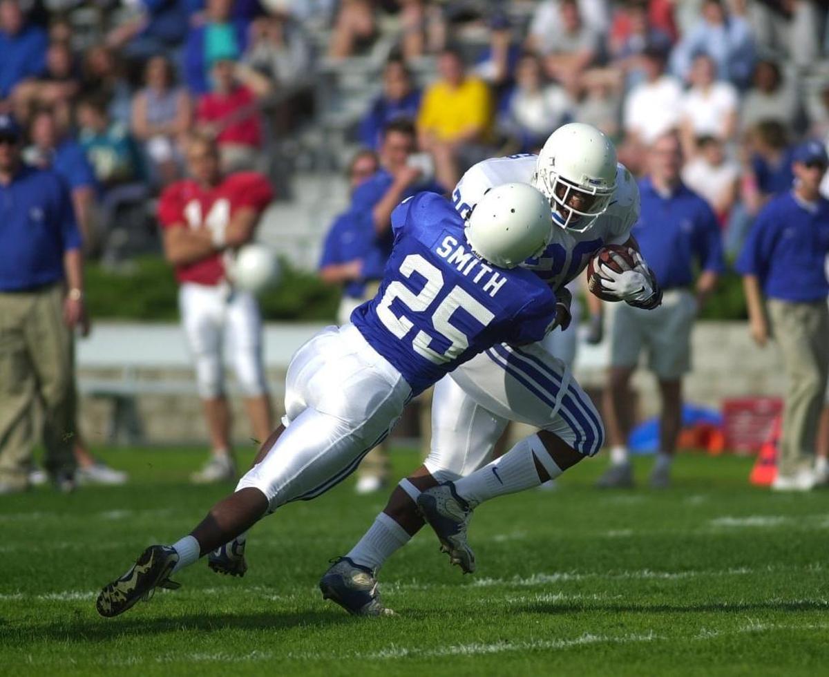 Kentucky runningback Artose Pinner,20 shook off the tackle attempt of safety Nigel Smith, and rumbled 32 yards to the one yard line during the fourth quarter of the Blue-White football scrimmage on saturday April 21,2001 in Georgetown Ky at Rawlings Stadium.
