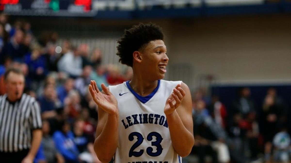 Lexington Catholic Knights' Zan Payne celebrates in the closing seconds against the Lafayette Generals during the semifinals of the 43rd District tournament at the Beuter Gymnasium at Lexington Catholic High School in Lexington, KY on Wednesday, February 22, 2017.