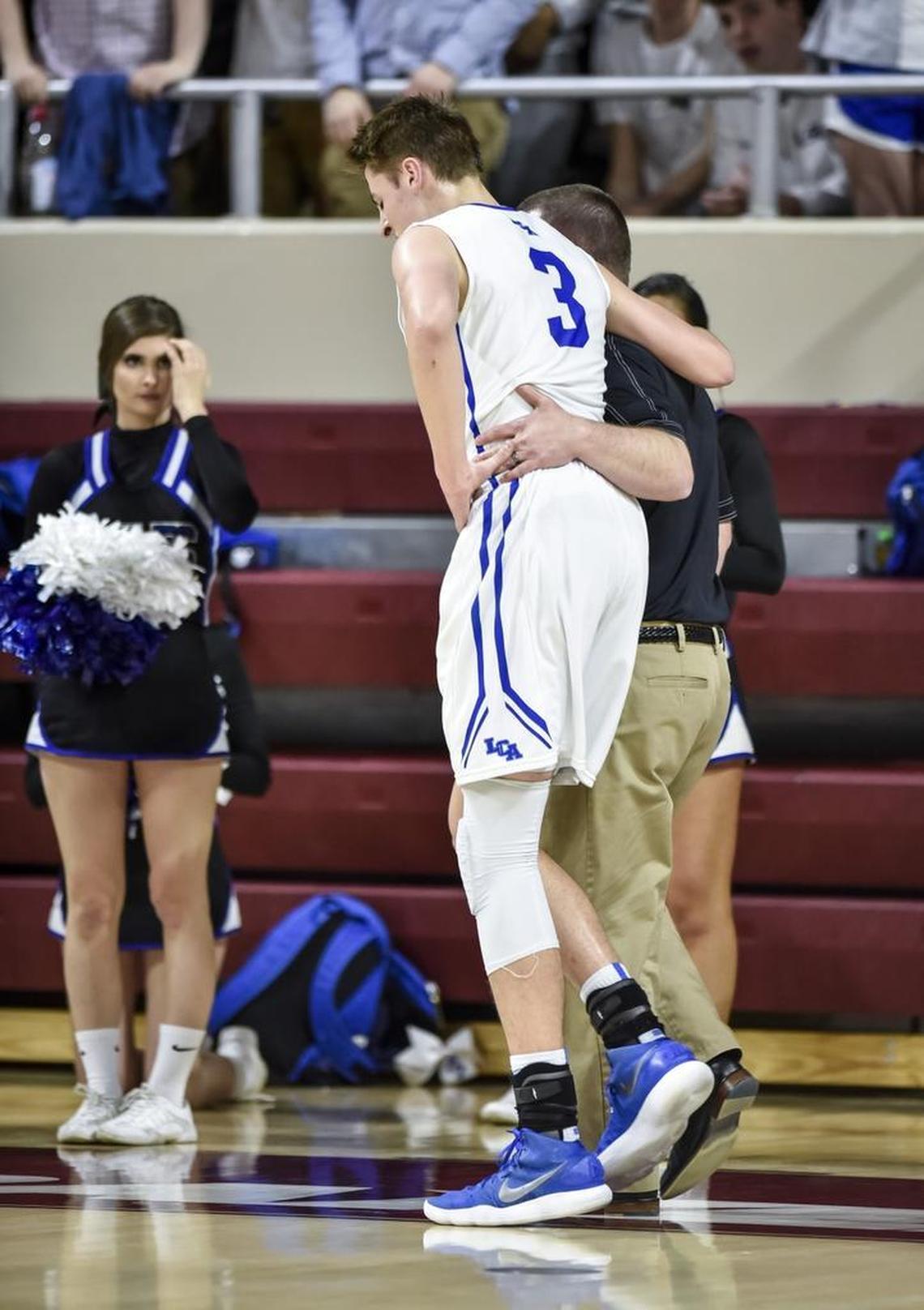 LCA's Carter Hendricksen (3) left in the third quarter with a leg injury and did not return to the game, during the finals of the boys 11th Region tournament, Monday, March 5, 2018, at EKU's McBrayer Arena in Richmond.