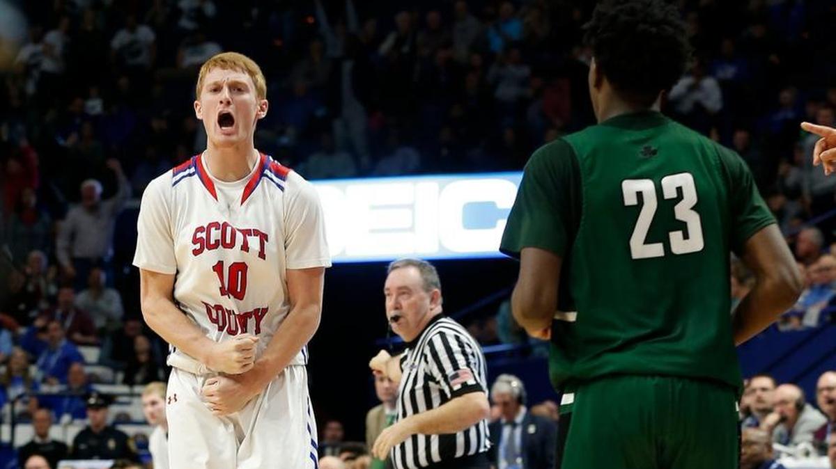 Scott County's Cooper Robb reacted to his game winning three-pointer against Trinity in an opening-round game at the 101st Whitaker Bank/KHSAA Boys' Sweet Sixteen state basketball tournament.