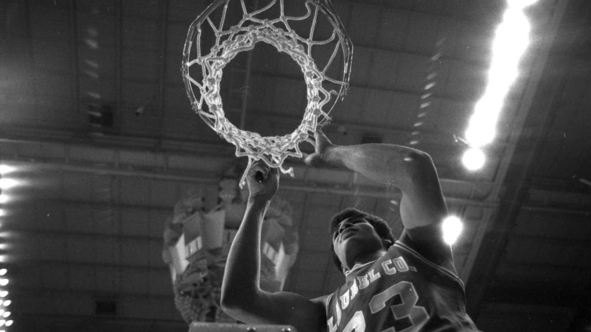 Paul Andrews of Laurel County, whose long-distance shot at the buzzer defeated North Hardin in the 1982 state championship game, cut down the net afterward.