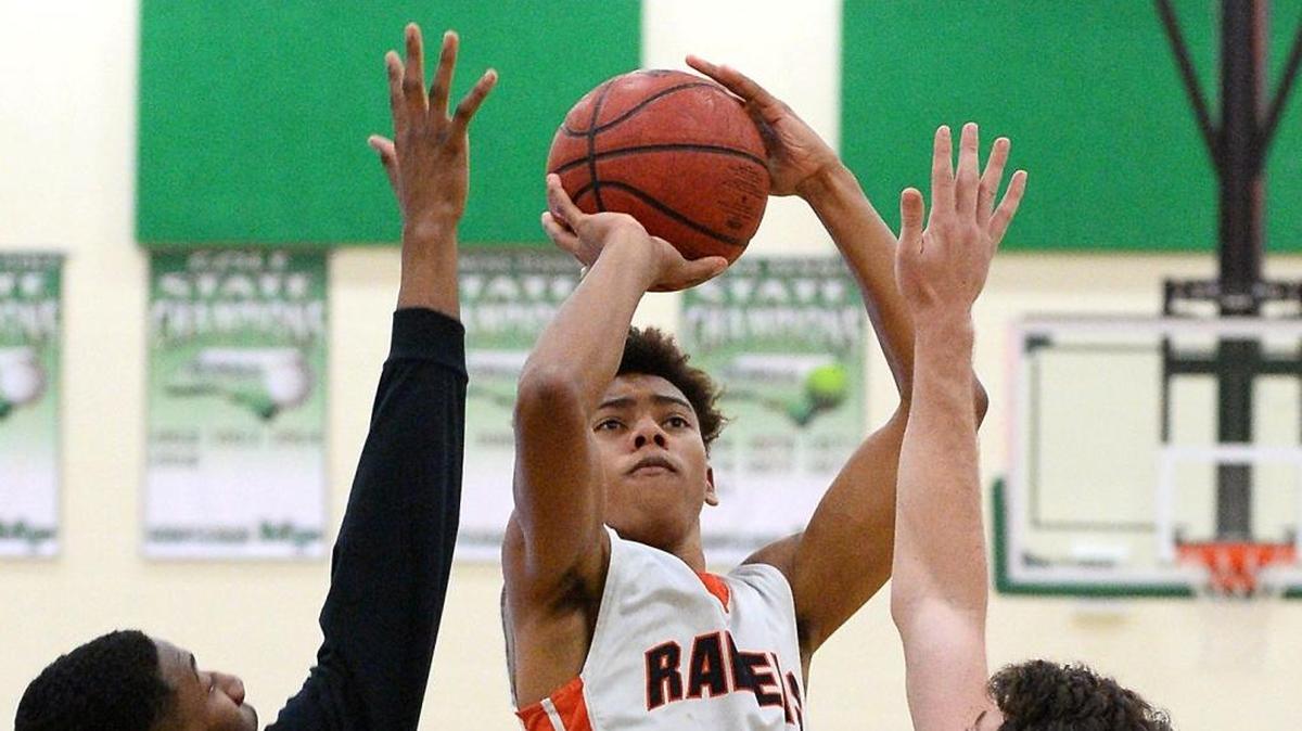 Rocky River (N.C.) sophomore Jaden Springer, center, is ranked in the top 10 nationally in his class. His team is playing in the finals of the Traditional Bank Holiday Classic at Lexington Catholic on Saturday, December 30, 2017, in Lexington, Ky.