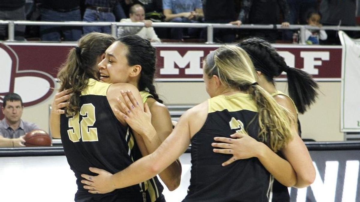 Murray's Alexis Burpo, left, hugs leading scorer Alexandria Mayes after defeating Shelby Valley to win the girls' All 'A' Classic championship at Alumni Coliseum in Richmond, Ky., Sunday, January 28, 2018.