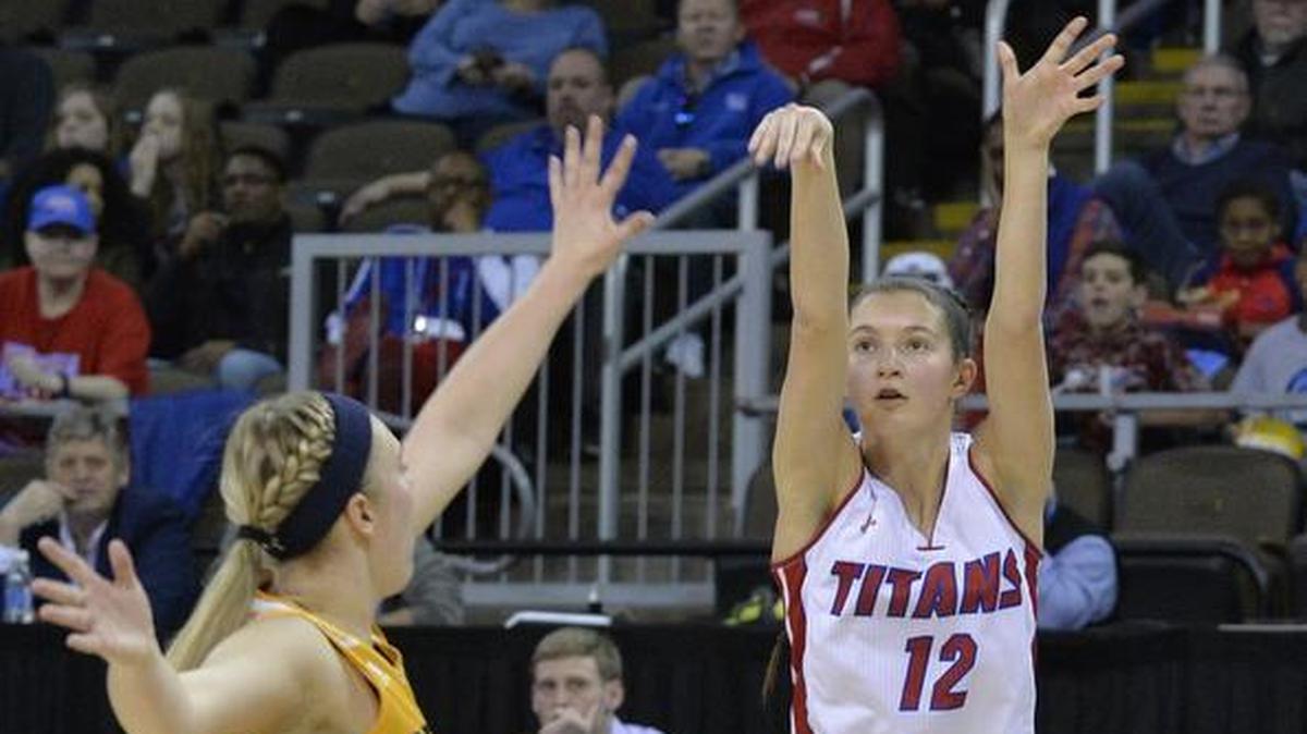 Mercer County's Lexy Lake (12) shoots a three pointer over the reach of Franklin County's Savannah Courtney (22) during the second half of the Kentucky state high school girls championship game, Sunday, March 12, 2017, in Newport, Ky. Mercer County won 85-71.