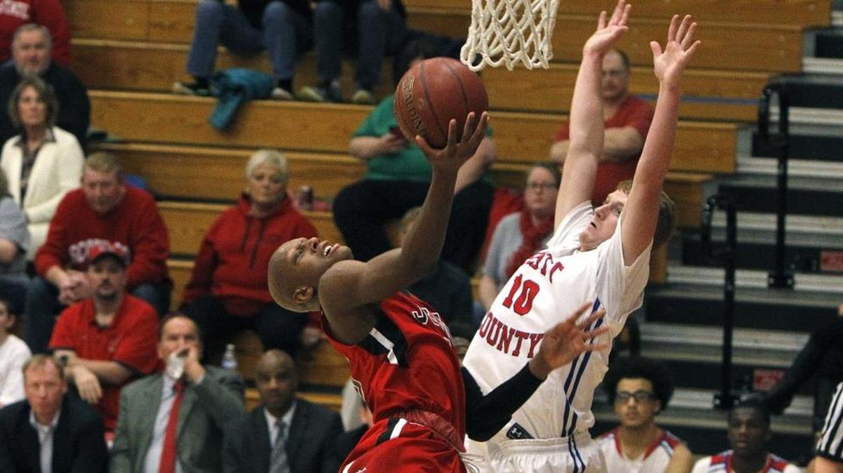 John Hardin’s Mickey Pearson took a shot against Scott County’s Cooper Robb on Saturday during the Jock Sutherland Classic at Lafayette High School.