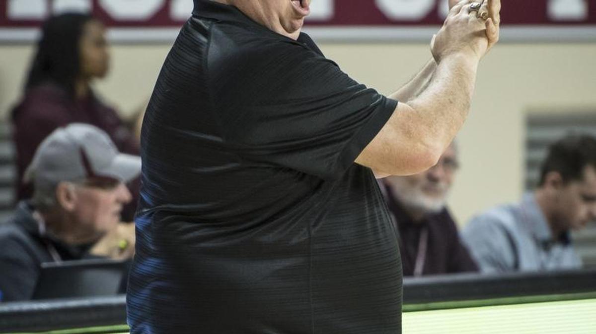 Woodford coach Jay Lucas reacts as Woodford County's Abby Moffett (24) banks in a 3-pointer late in the game against Lafayette, during the girls 11th Region Tournament, Monday, February 27, 2017, at EKU's McBrayer Arena in Richmond.
