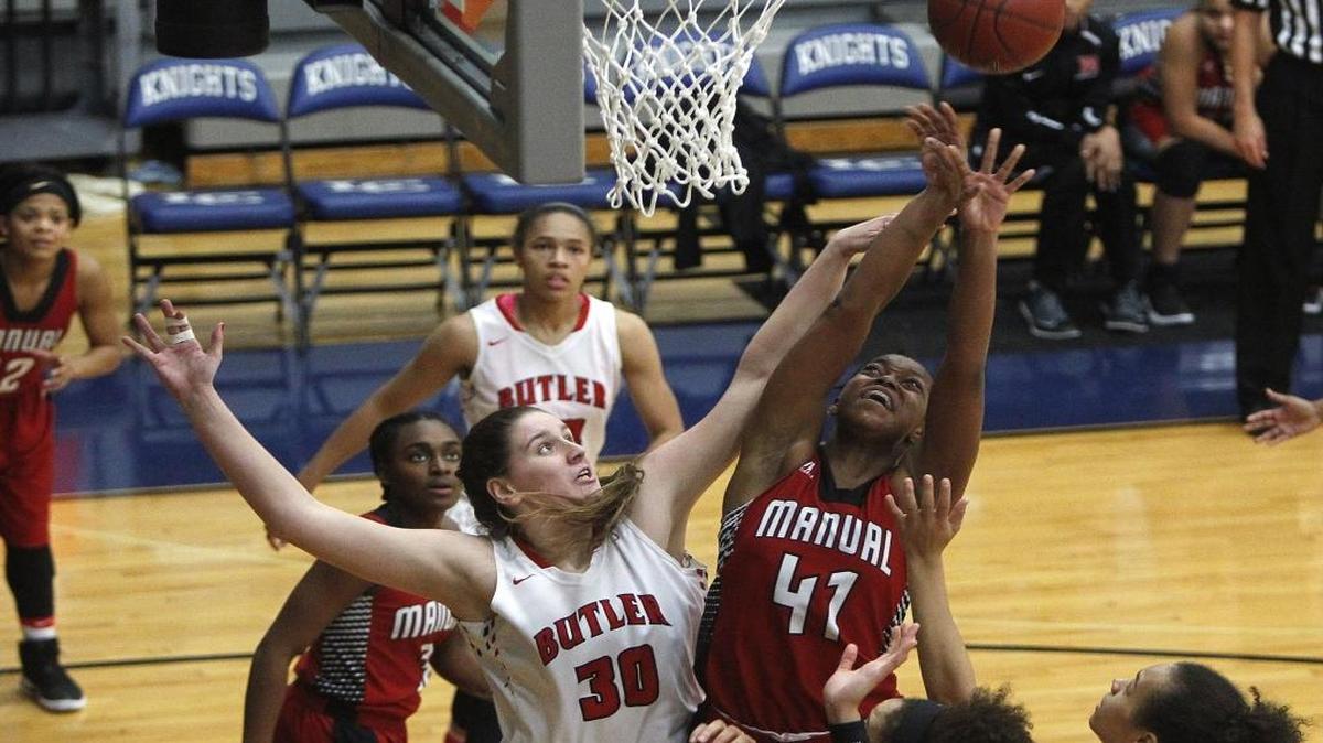 Manual's Nila Blackford was pressured by Butler's Molly Lockhart as she shoots in the finals of the Traditional Bank Holiday Classic in the Beuter Gymnasium at in Lexington on Dec. 23, 2016.