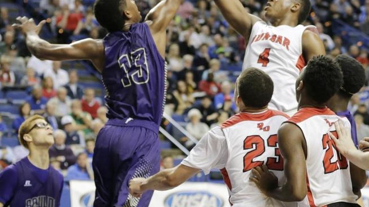 Bowling Green's Kyran Jones (13) blocked a shot by Dunbar’s Dontell Brown (4) in the second quarter of the Dunbar vs Bowling Green 2016 Whitaker Bank/KHSAA Boys Sweet 16 basketball tournament quarterfinal game at Rupp Arena in Lexington, Ky., on March 18, 2016.