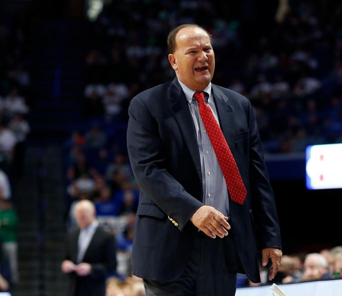 Scott County head coach Billy Hicks was upset with a call as Scott County played Trinity in an opening round game at the 101st Whitaker Bank/KHSAA Boys' Sweet Sixteen state basketball tournament being played Wednesday at Rupp Arena in Lexington. This is first quarter action.