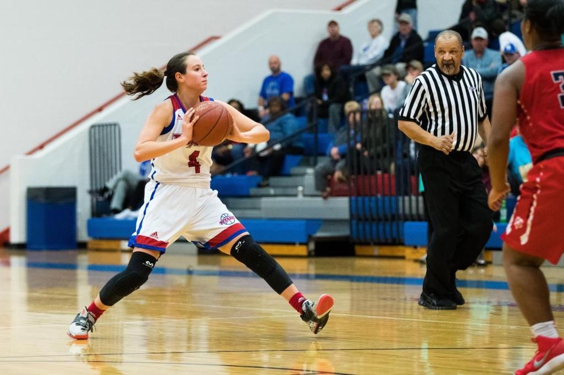 Mercer County's Seygan Robins (4) passed the ball as host Mercer defeated Butler 68-45.