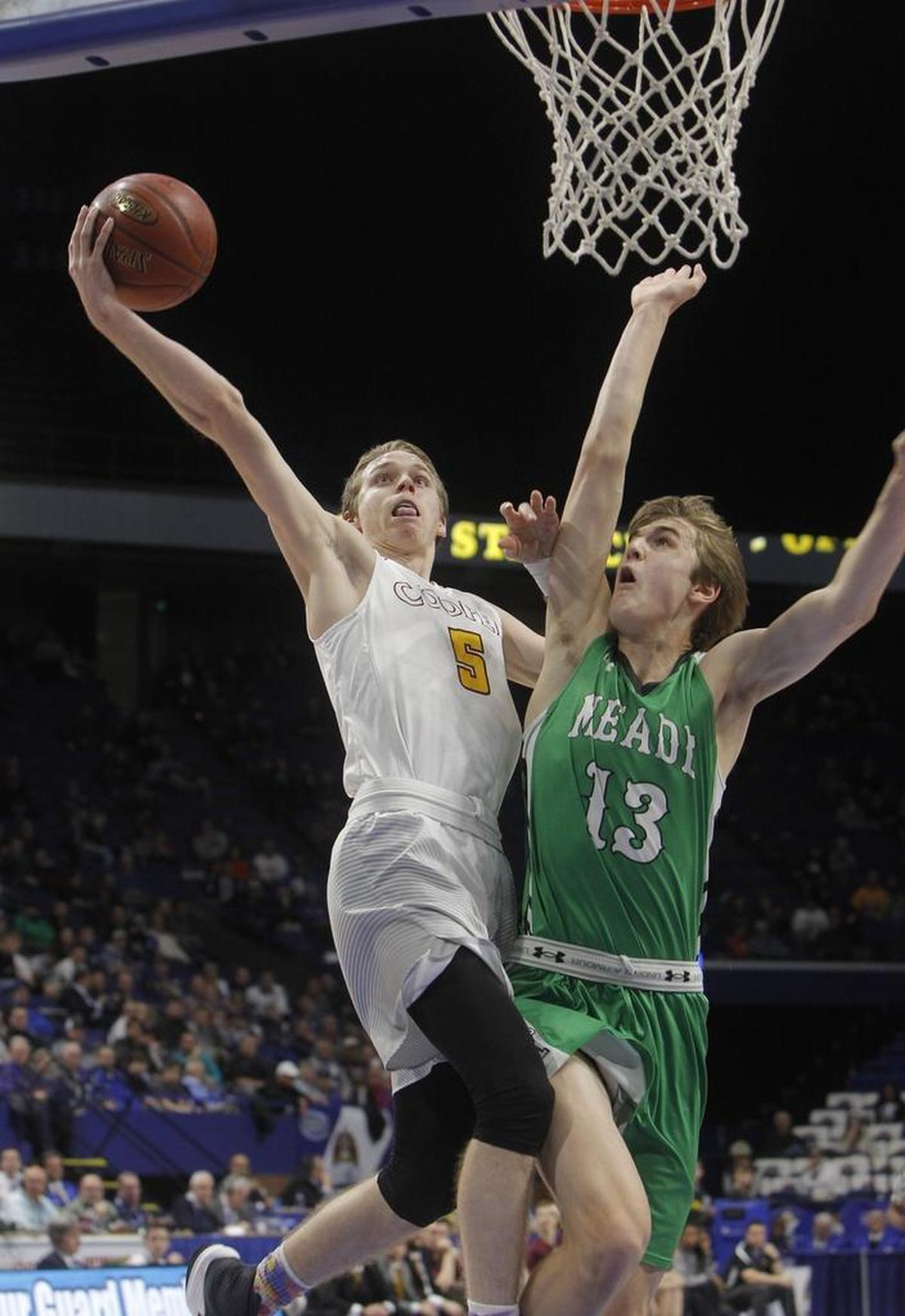 Cooper's Adam Kunkel shoots against Meade County's Aiden Matthews during the first round of the Whitaker Bank/KHSAA Boys' Sweet 16 at Rupp Arena in Lexington, Ky., Thursday, March 16, 2017.