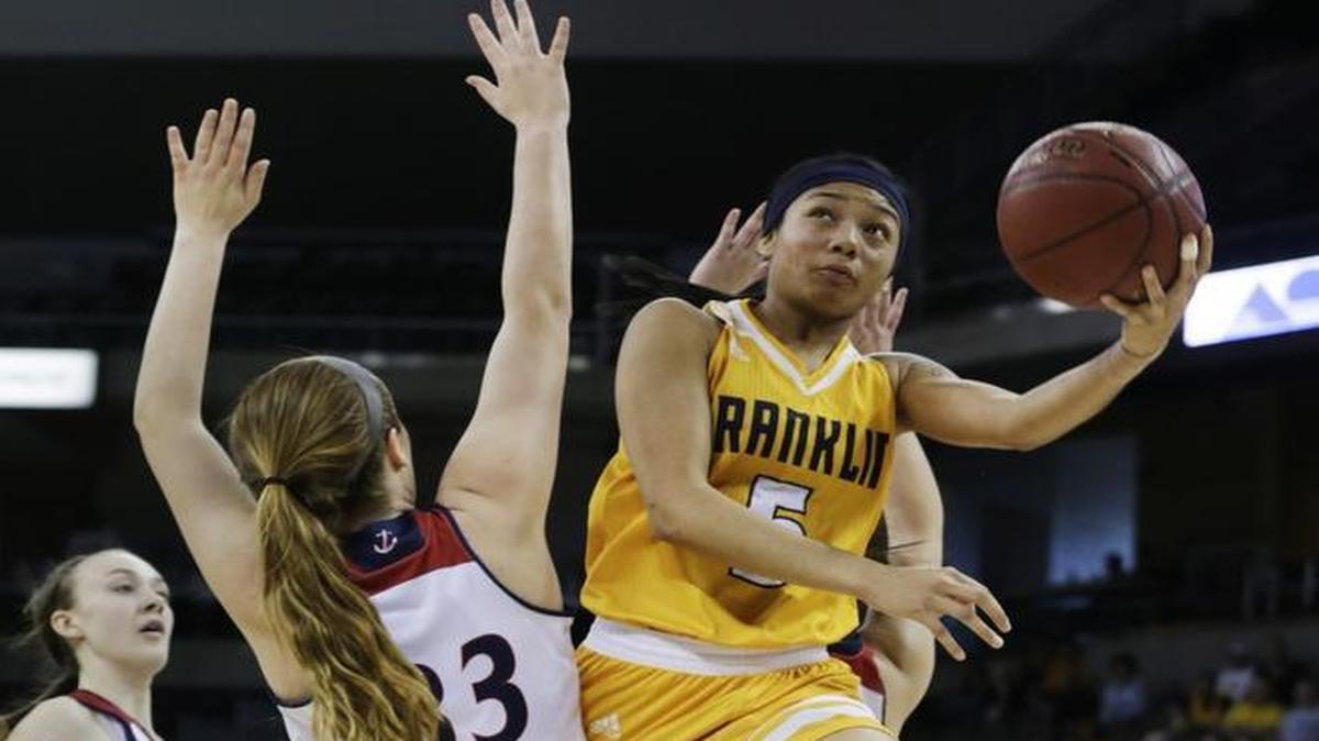Franklin County’s Princess Stewart (5) broke past Russell County’s Madelyn Preston (33) to score in the Girls’ Sweet Sixteen in Highland Heights, Ky., on March 9, 2017. Stewart will play in the Kentucky-Indiana All-Star games.