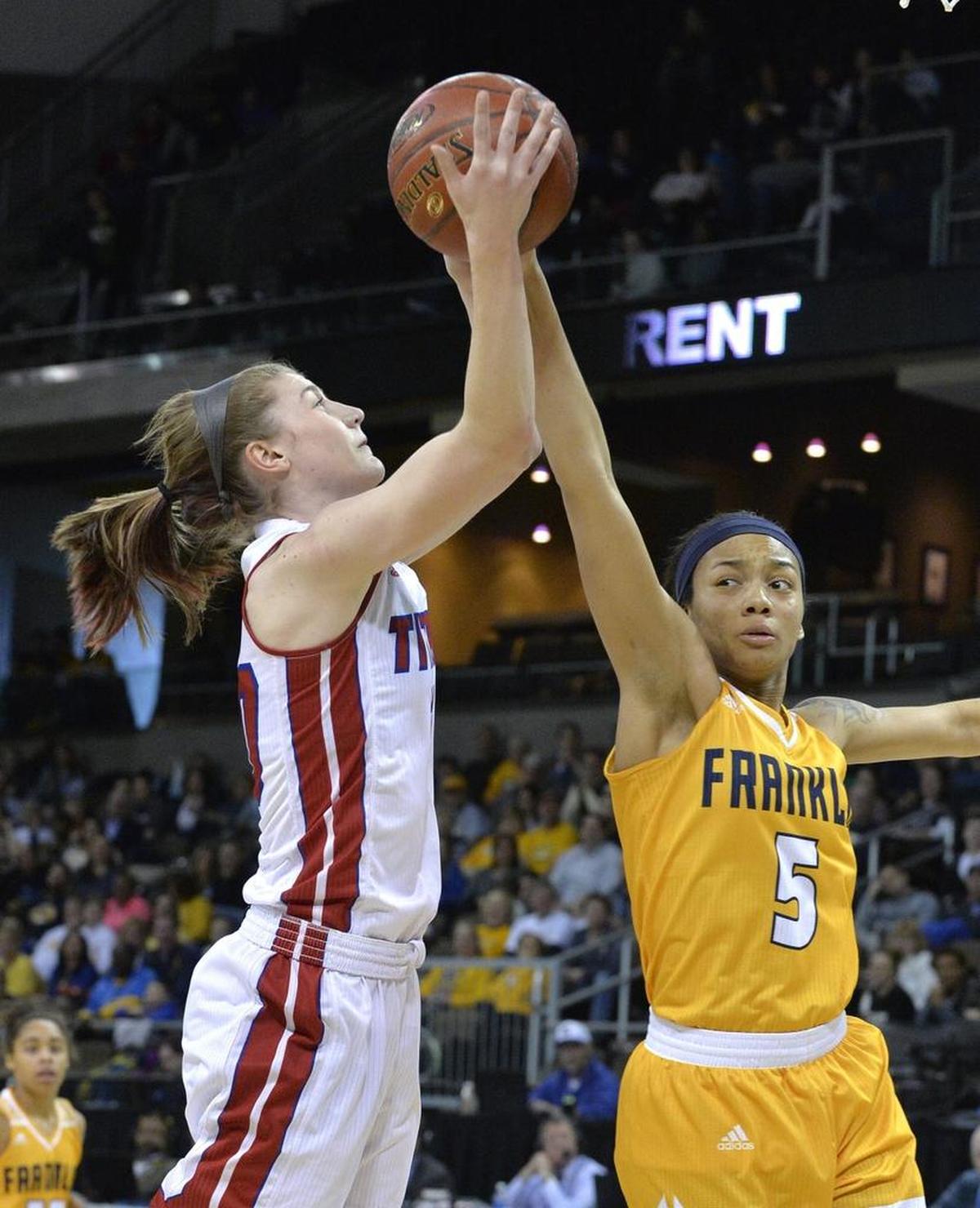 Mercer County's Emma Souder, left, is fouled by Franklin County's Princess Stewart (5) during the second half of the Kentucky state high school girls' championship basketball game, Sunday, March. 12, 2017, in Newport, Ky.