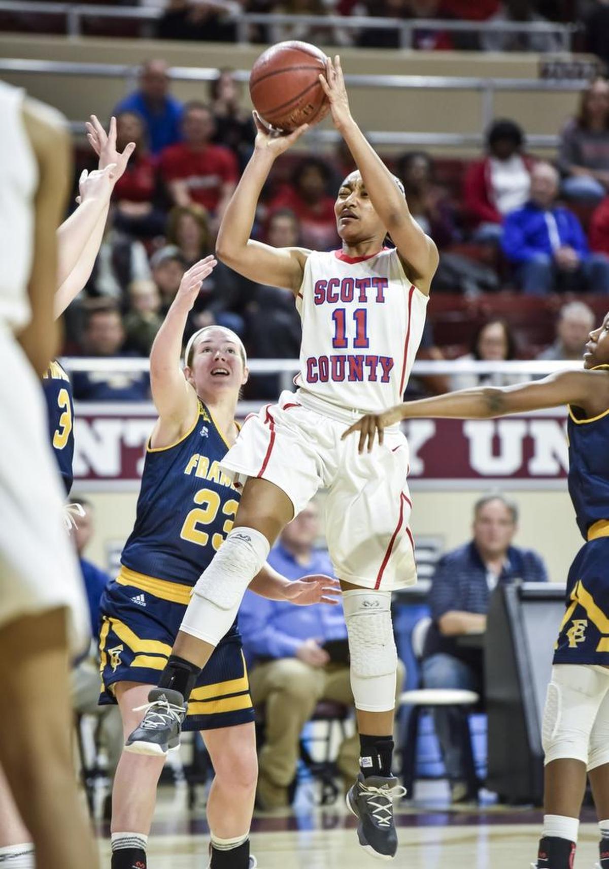 Scott County’s Maaliya Owens shot past Franklin County’s Emily Jordan during the finals of the 11th Region Tournament at EKU last Saturday.
