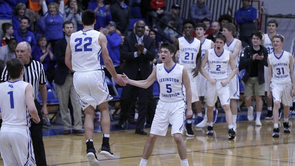 Lexington Christian’s Ezekiel Grier slapped hands with Kyle Rode after the Eagles ended the first quarter up by 13 points against Lafayette during the boys’ 43rd District championship.