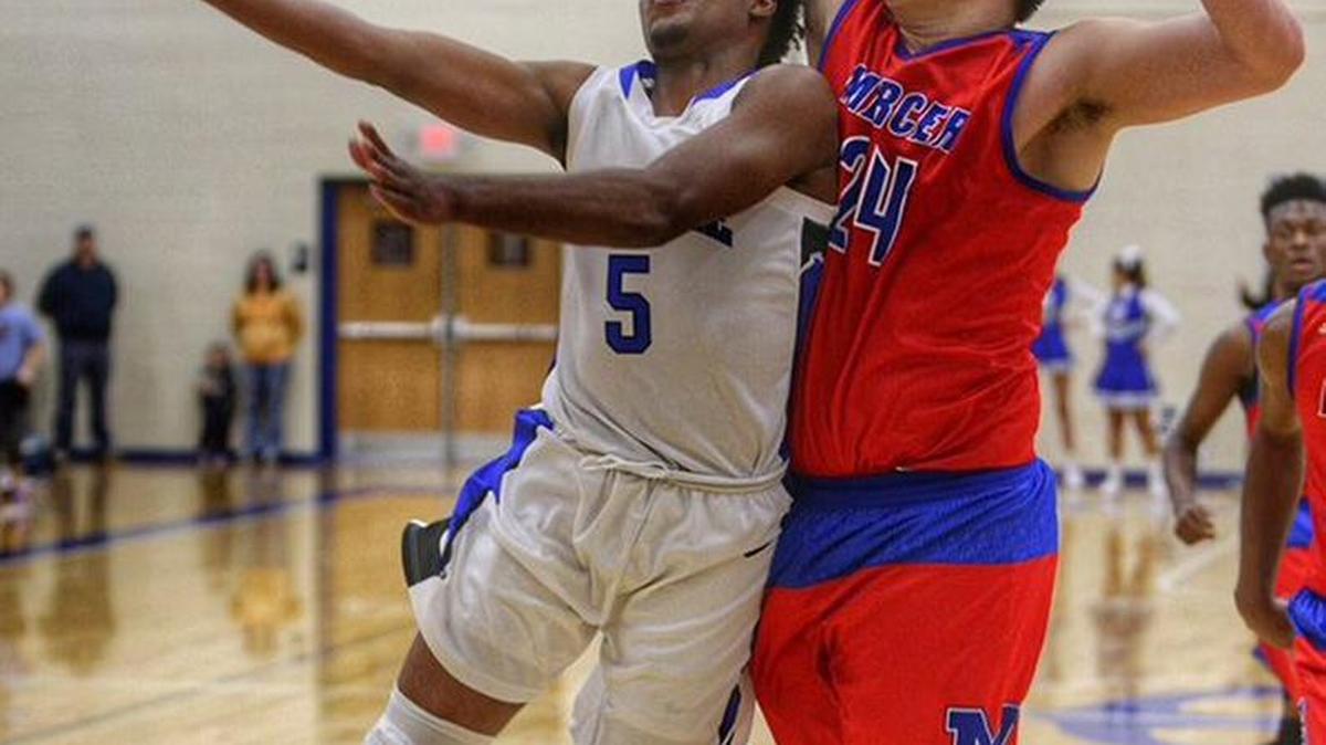 Dylan James applied pressure as Danville’s Darious Wilson drove to the basket. Wilson led Danville with 16 points on Monday, Jan. 5.