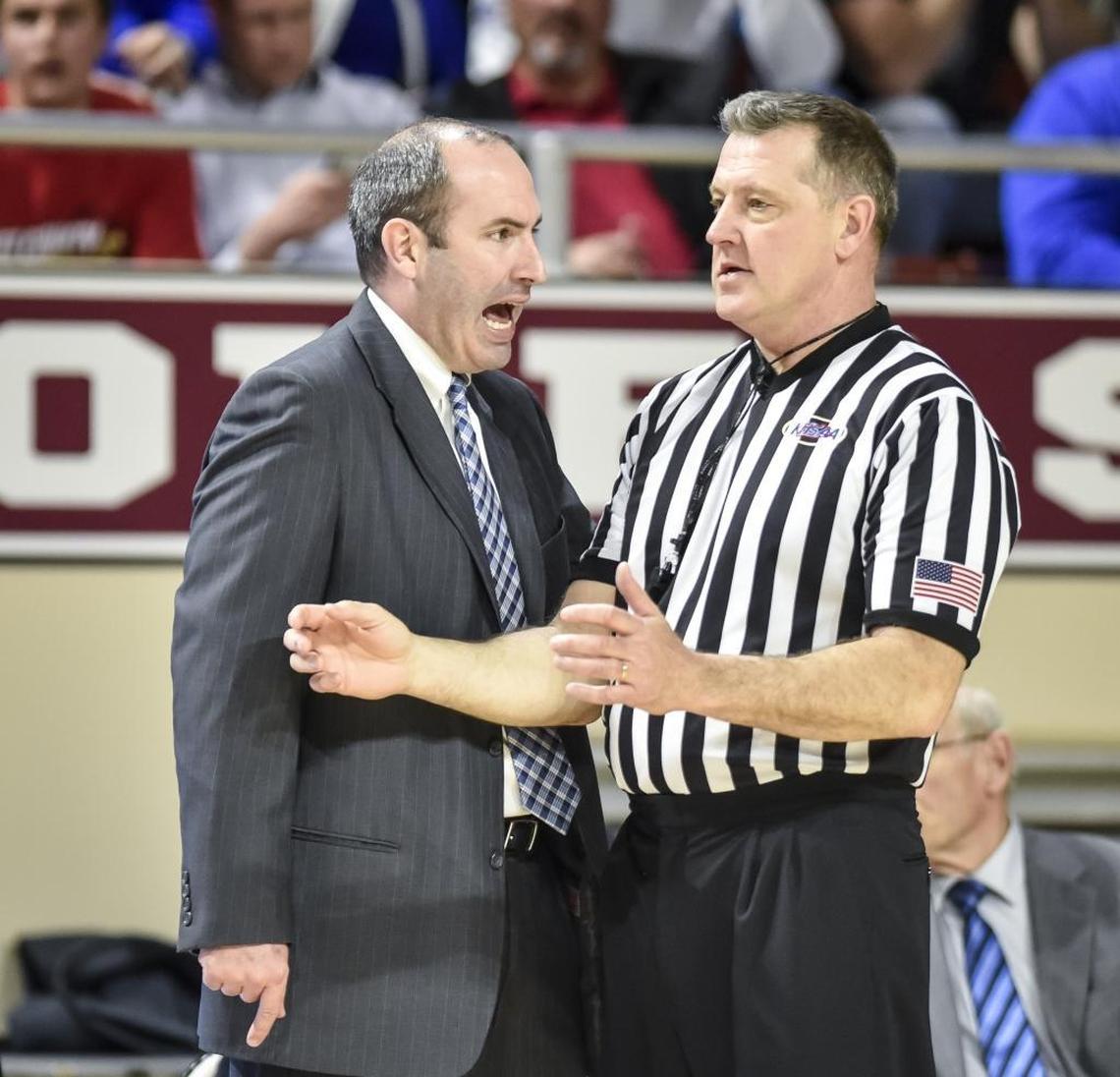 LCA head coach Nate Valentine argues a call against Scott County, during the finals of the boys 11th Region tournament, Monday, March 5, 2018, at EKU's McBrayer Arena in Richmond.