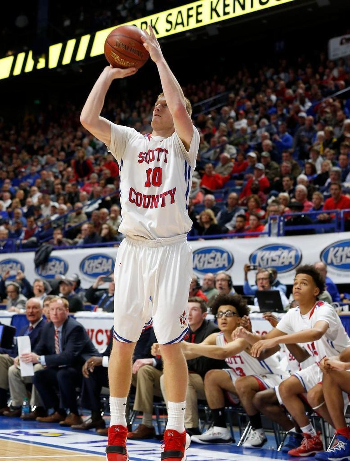 Scott County's Cooper Robb hit the game winning three-pointer as Scott County played Trinity in an opening round game at the 101st Whitaker Bank/KHSAA Boys' Sweet Sixteen state basketball tournament being played Wednesday at Rupp Arena in Lexington. This is third quarter action. Scott Co. won 54-53.