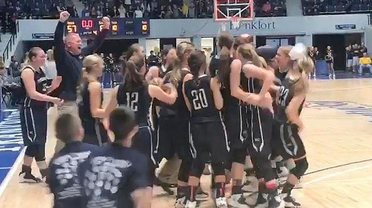 Monroe County Coach Dwayne Murray celebrated with his team after the buzzer as the Falcons defeated defending All “A” Classic champion Murray in Friday morning’s quarterfinals.