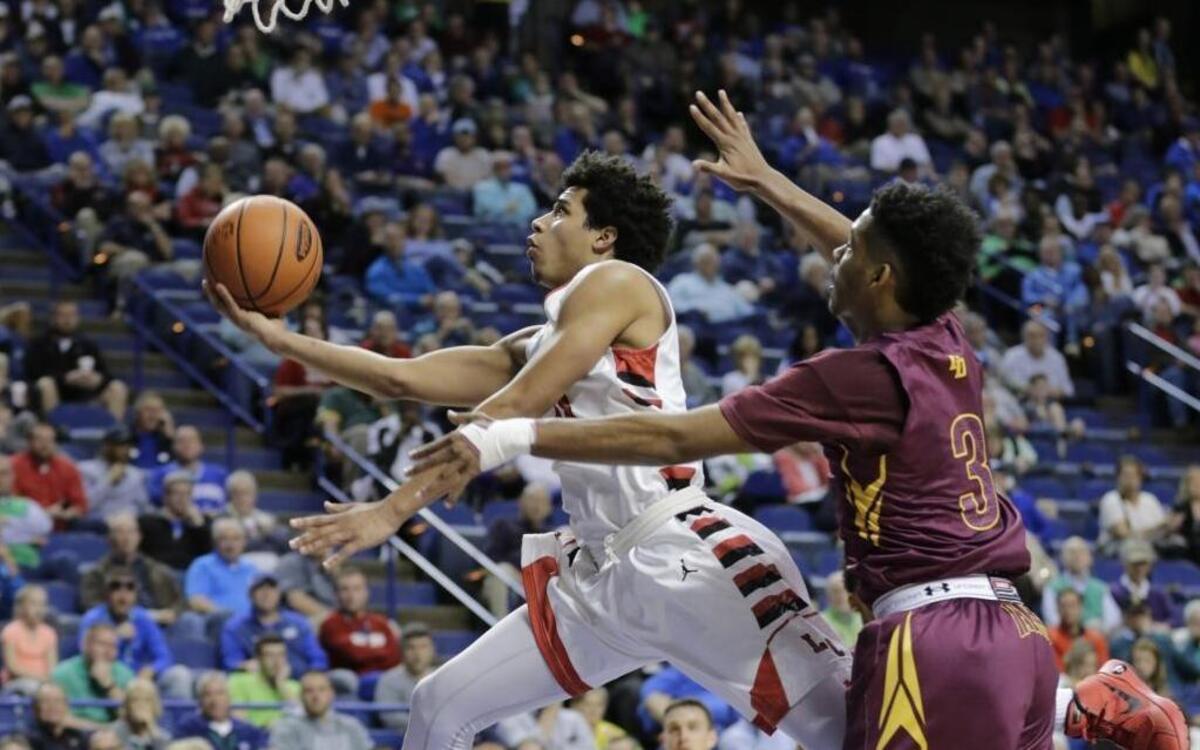 Lawrence County's Timmy Dalton (10) was defended by Doss' Laron Hargrove (3) in the 2016 Whitaker Bank/KHSAA Boys Sweet 16 basketball tournament at Rupp Arena in Lexington, Ky. Dalton led Lawrence County with 16 points.