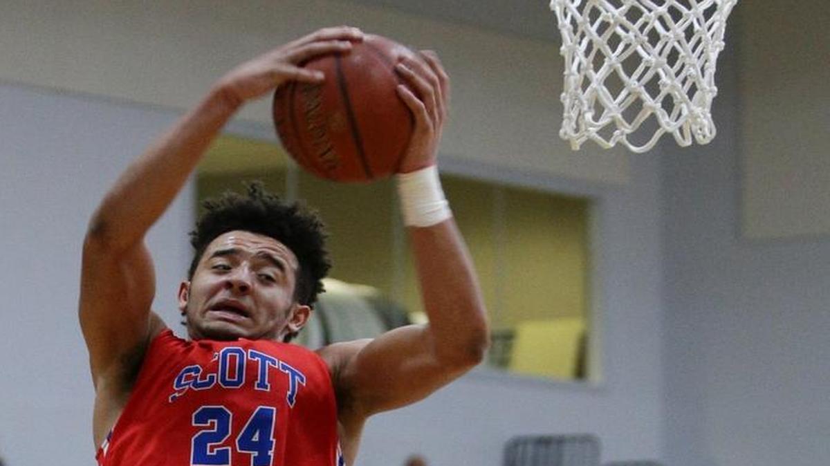 Scott County's Michael Moreno pulled a rebound as LCA played Scott County on Dec. 7, 2016, in Lexington.