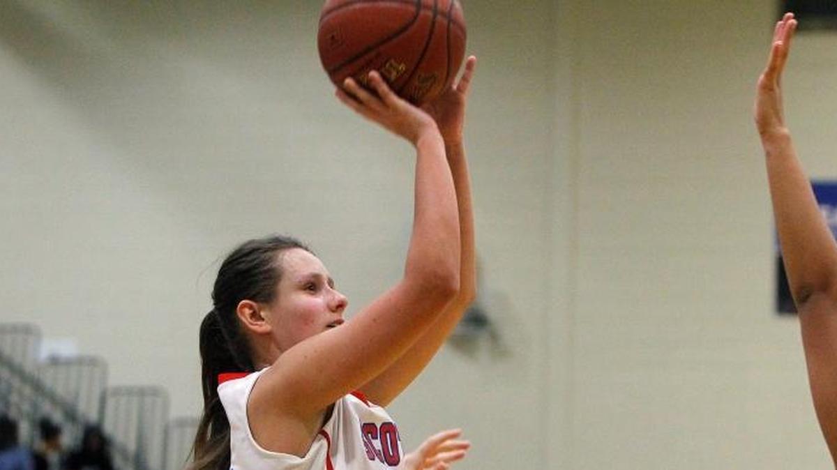 Scott County's Peyton Riddle shoots against Henry Clay in the championship game of the 42nd district tournament in the gym at Bryan Station high school in Lexington on Feb. 24, 2017.