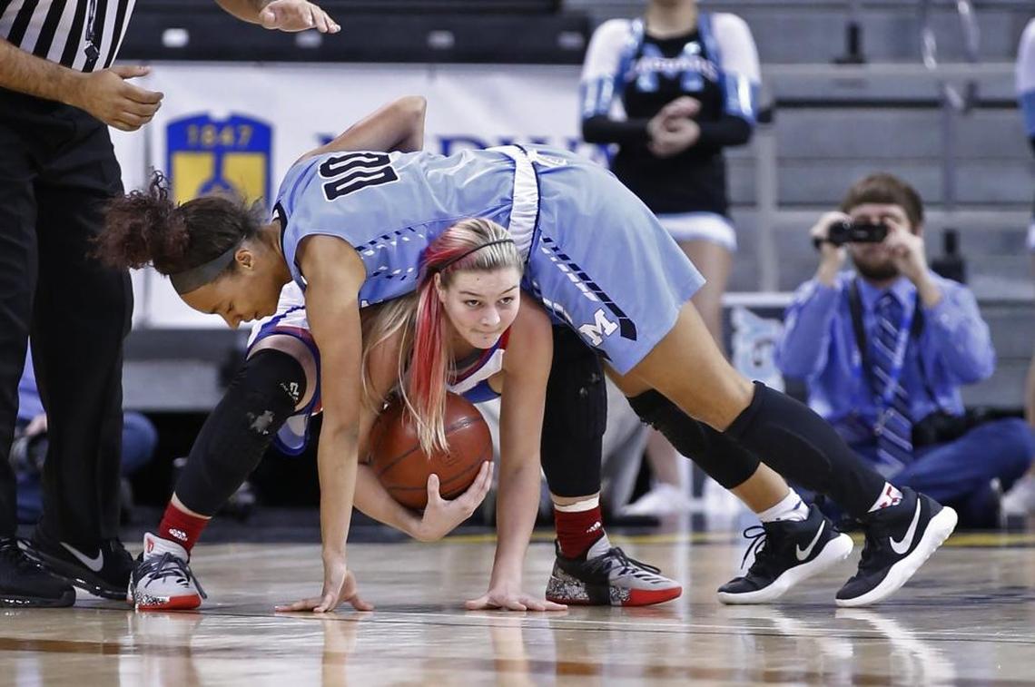 Mercy’s Jaylyn Shorter, top, fell over Mercer County’s Emma Davis during Sunday’s state championship game at Northern Kentucky University.