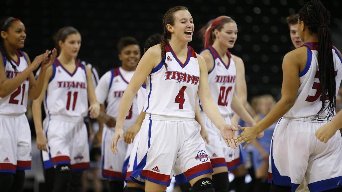 Mercer County’s Seygan Robins (4) and teammates celebrated after building an insurmountable lead against Mercy in the second quarter Sunday.