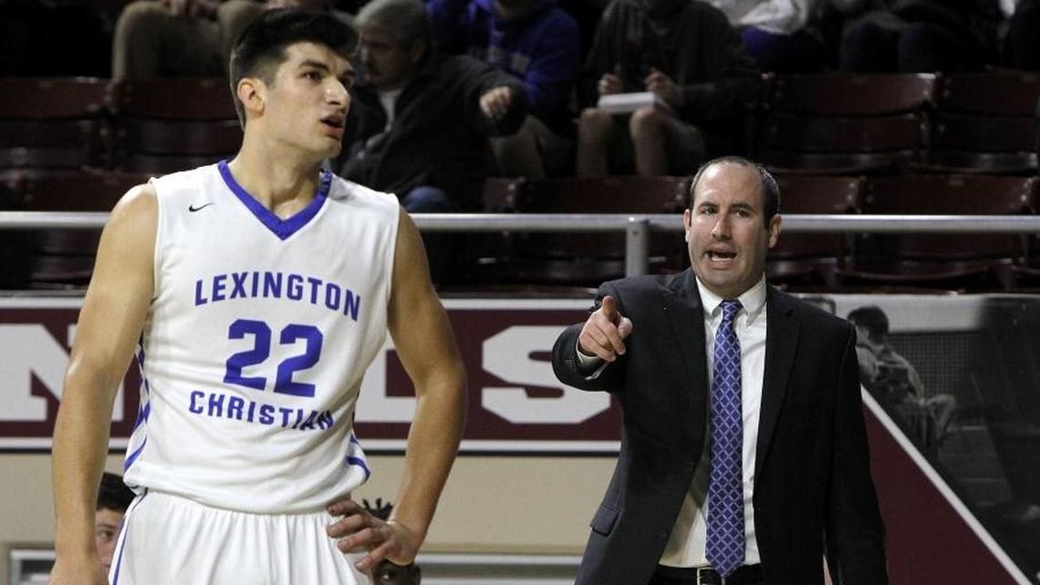 Lexington Christian coach Nate Valentine talks to Kyle Rode while playing University Heights in the first round of the All 'A' Classic at Alumni Coliseum in Richmond, Ky., Thursday, January 25, 2018.
