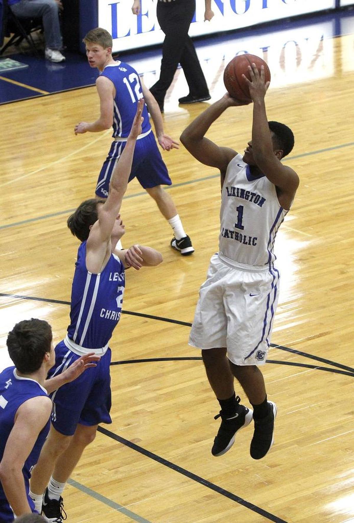 Lexington Catholic's Javen Hardin pulls up and shoots against Lexington Christian in the Bueter Gymnasium at Lexington Catholic in Lexington, Ky., Tuesday, January 2, 2018.