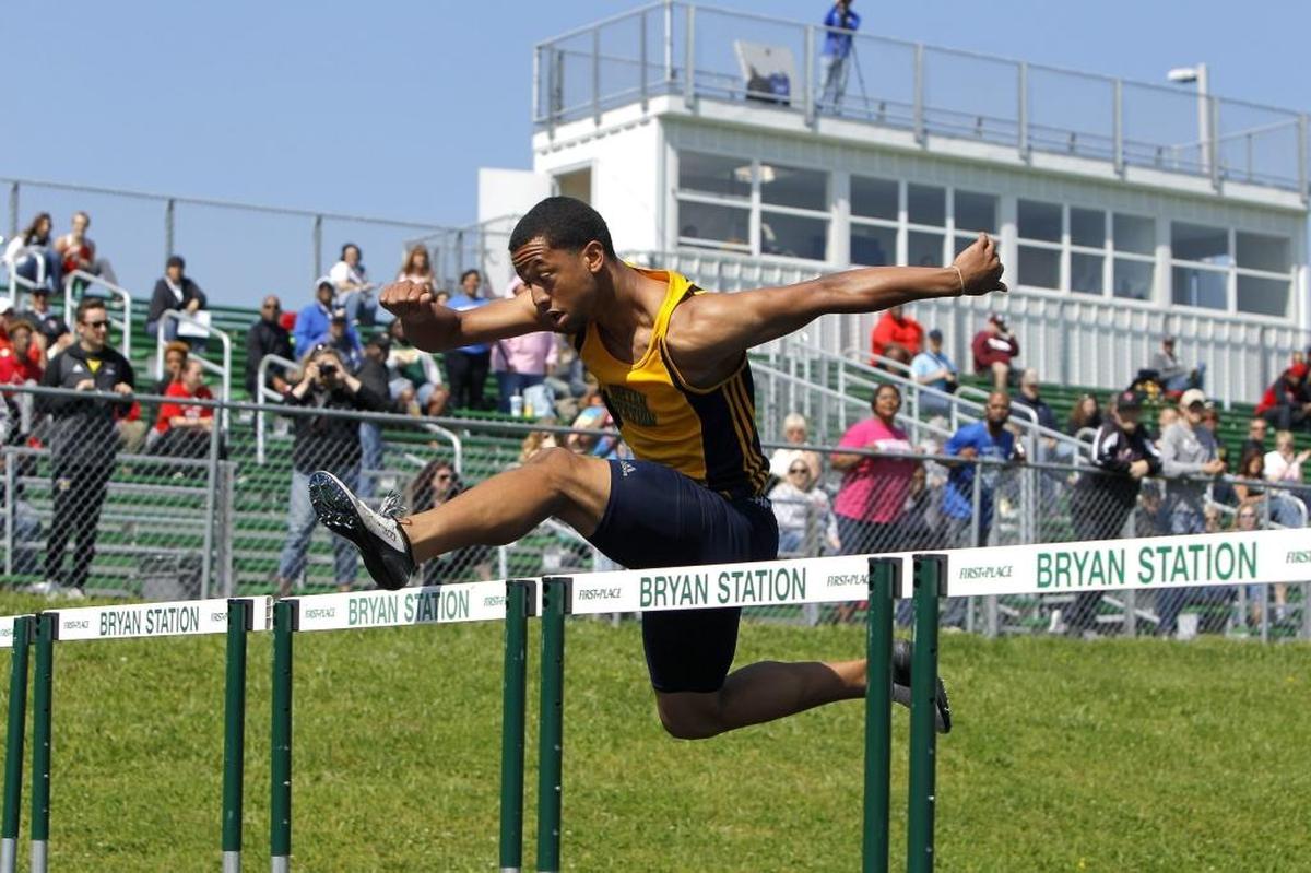 Bryan Station's Isaiah McCall clears a fence while winning the 110m hurdle at the region 6 track tournament for Class 3A at R. L. Grider Stadium at Bryan Station high school in Lexington, Ky., Saturday, May 13, 2017.
