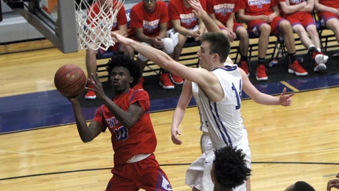 Madison Central's Jacori Miller shot as Lexington Catholic's Jackson Smith defended Tuesday at Lexington Catholic.