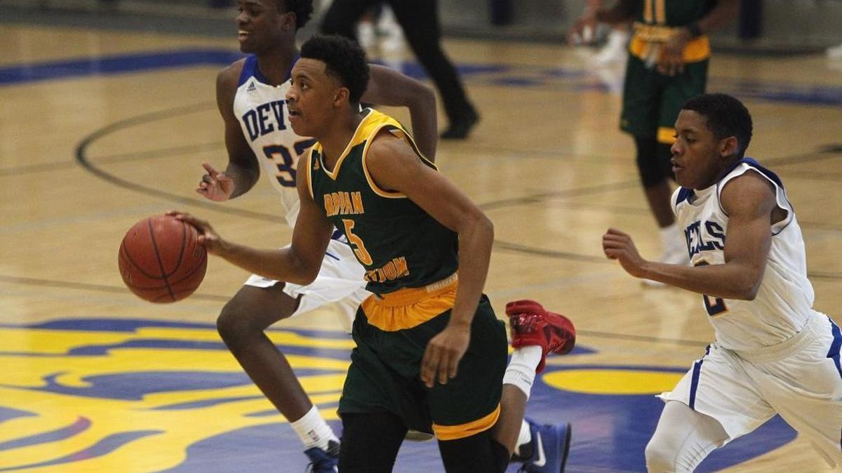 Bryan Station's Eric Boone drives against Henry Clay in the Al Prewitt Gymnasium in Lexington, Ky., Tuesday, January 10, 2017.