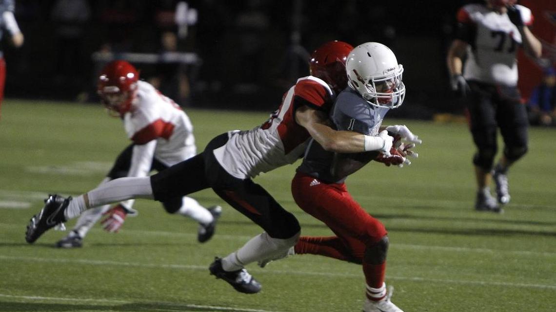 Scott County's Cooper Robb makes the tackle against Lafayette's Caylon Williams in the Blanton Collier Kickoff Classic at Ishmael Stadium in Lexington, Ky., Friday, August 25, 2017.