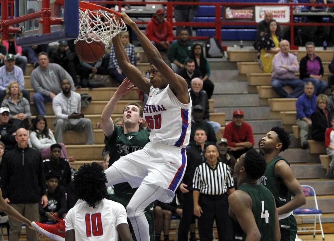 Madison Central's Isaiah Cozart dunks against Trinity at Madison Central gymnasium in Richmond, Ky., Friday, January 26, 2018.