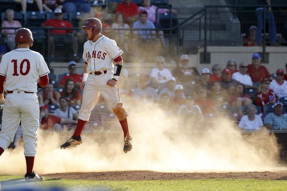 Scott Co. fans can only watch as McCracken County's Trent Shelby celebrates after stealing home to score on a wild pitch against Scott Co. in the quarterfinals of the KHSAA State Baseball Championship at Whitaker Bank Ballpark in Lexington, Ky., Saturday, June 10, 2017.