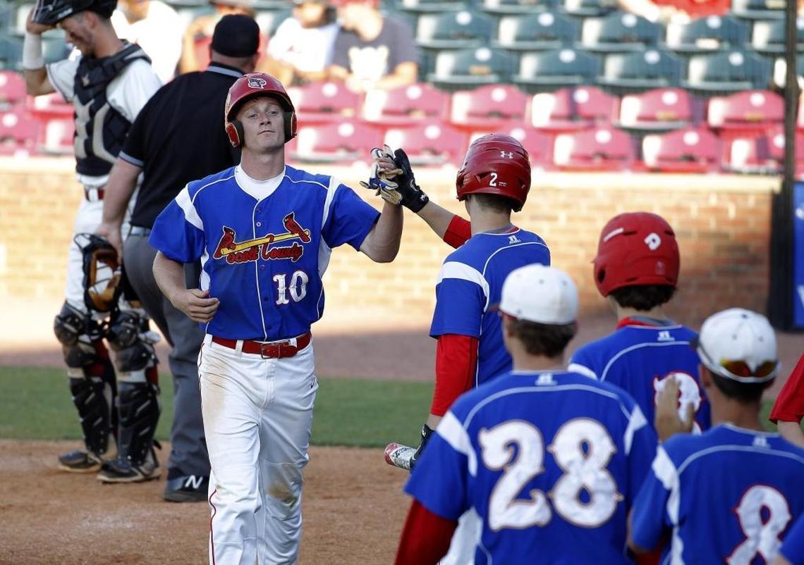 Scott County's Cooper Robb is congratulated after scoring his second run against McCracken Co. in the quarterfinals of the KHSAA State Baseball Championship at Whitaker Bank Ballpark in Lexington, Ky., Saturday, June 10, 2017.