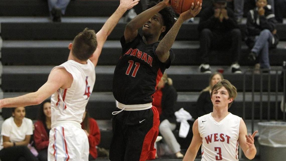 Paul Laurence Dunbar's Taveion Hollingsworth shoots against West Jessamine at West Jessamine High School in Nicholasville, Ky., Tuesday, February 14, 2017.