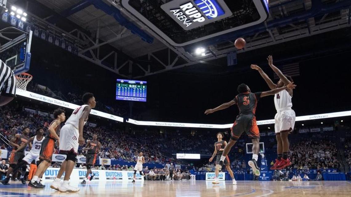 Ballard Marshon Ford (4) shot over Fern Creek Anthony Wales (5) as Fern Creek and Ballard played in the quarter finals of the Whitaker Bank/KHSAA Boys' Sweet 16 at Rupp Arena on Friday March 17, 2017 in Lexington, Ky.