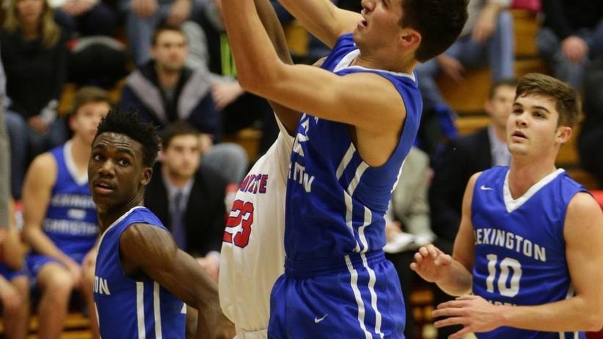 Lexington Christian’s Kyle Rode (22) pulled down a rebound against Lafayette last season.