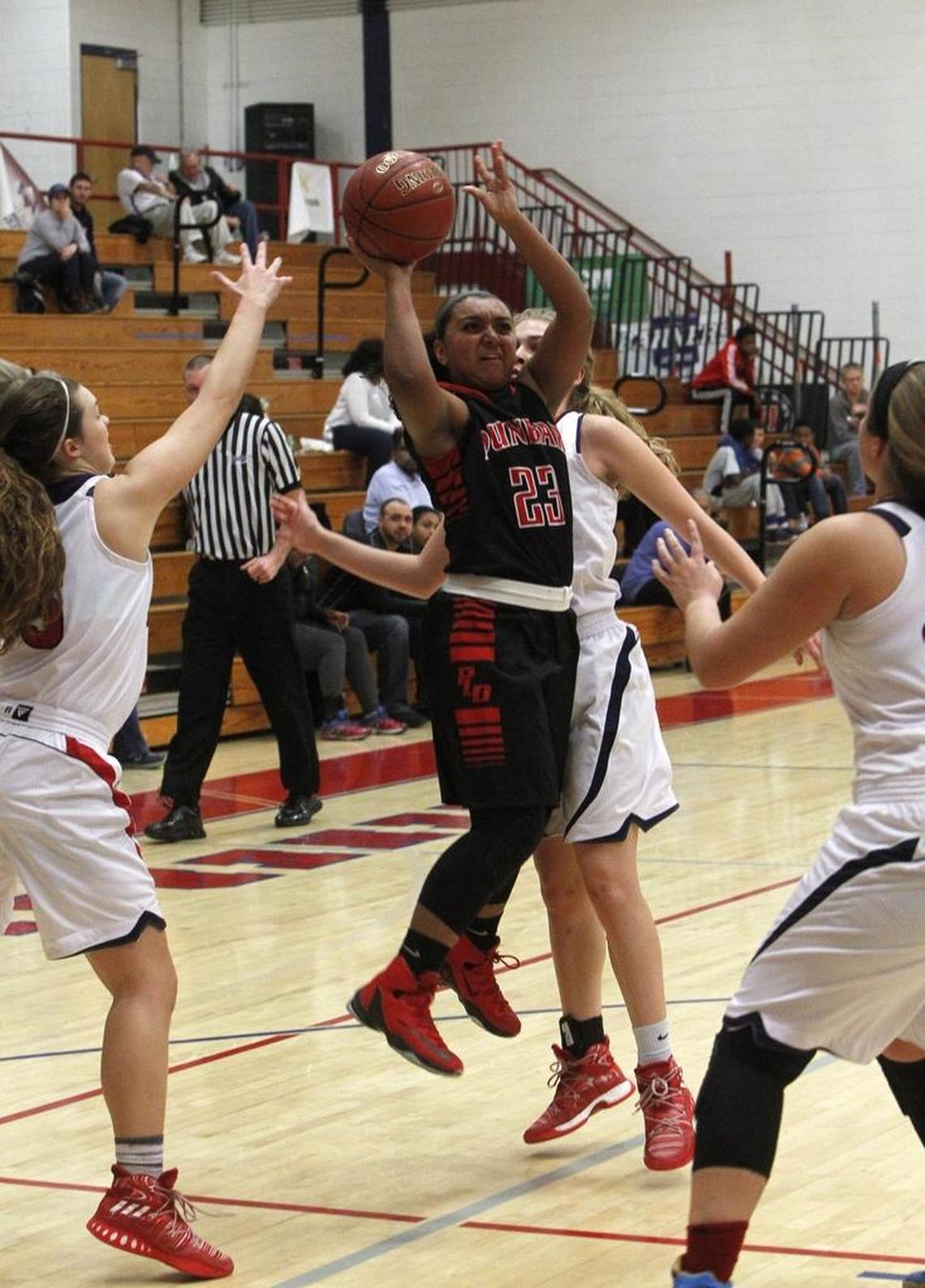 Paul Laurence Dunbar's Mashayla Cecil shoots against Lafayette at Lafayette's gymnasium in Lexington, Ky., Monday, January 16, 2017.
