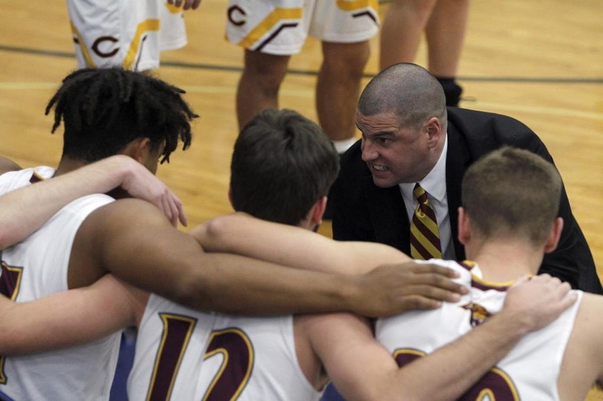 Cooper head coach Tim Sullivan talks to his starting five prior to playing The Skills Academy during the semifinals of the Republic Bank Holiday Classic in the Bueter Gymnasium at Lexington Catholic in Lexington, Ky., Friday, December 29, 2017.
