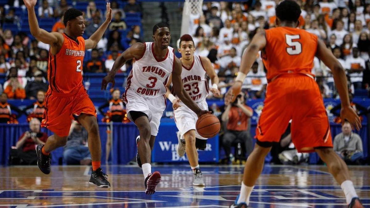 Taylor County guard Quentin Goodin, center, broke the press in the second half. Goodin scored 23 points to lead all scores in the game. Hopkinsville won the game 76-64 Taylor County hosted Hopkinsville in game two of the 2015 KHSAA Boy's Sweet 16 Tournament, Wednesday, March 18, 2015 at Rupp Arena in Lexington.