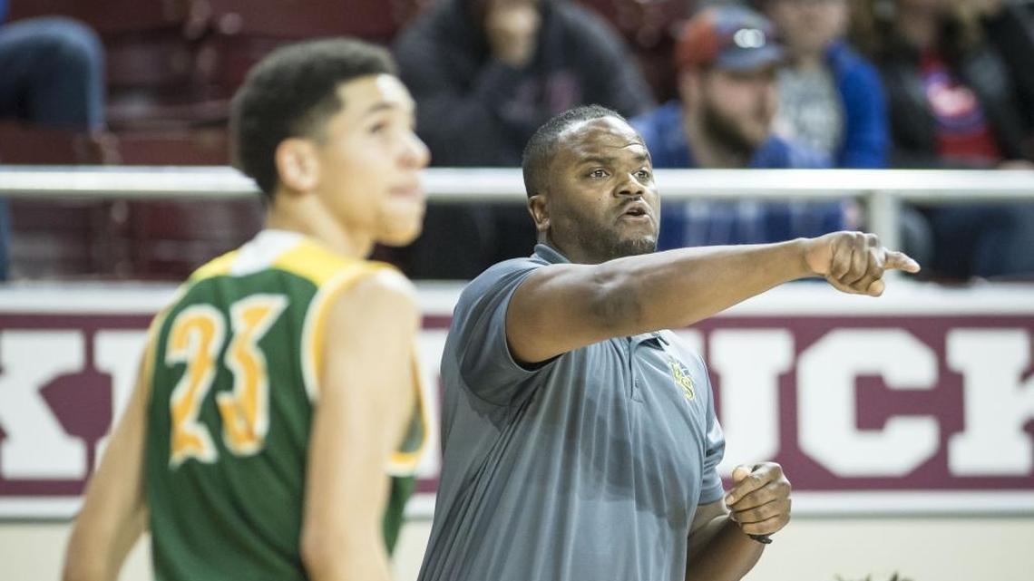 Bryan Station head coach Tommy Johnson gives his team instructions against Madison Central, during the first round of the 11th Region tournament, Wednesday night, February 28, 2018, at EKU's McBrayer Arena in Richmond.