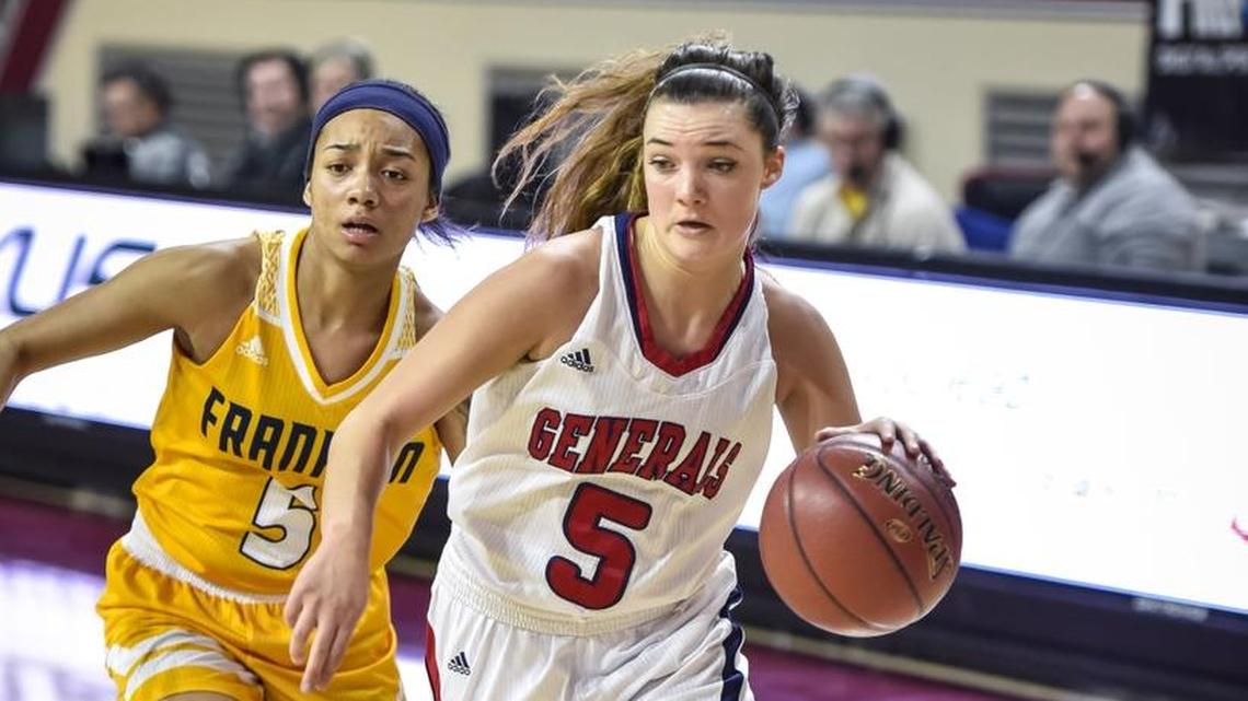 Lafayette's Caroline Bennett (5) drives around Franklin County's Princess Stewart (5), during the girls 11th Region Tournament finals, Saturday, March 4, 2017, at EKU's McBrayer Arena in Richmond.