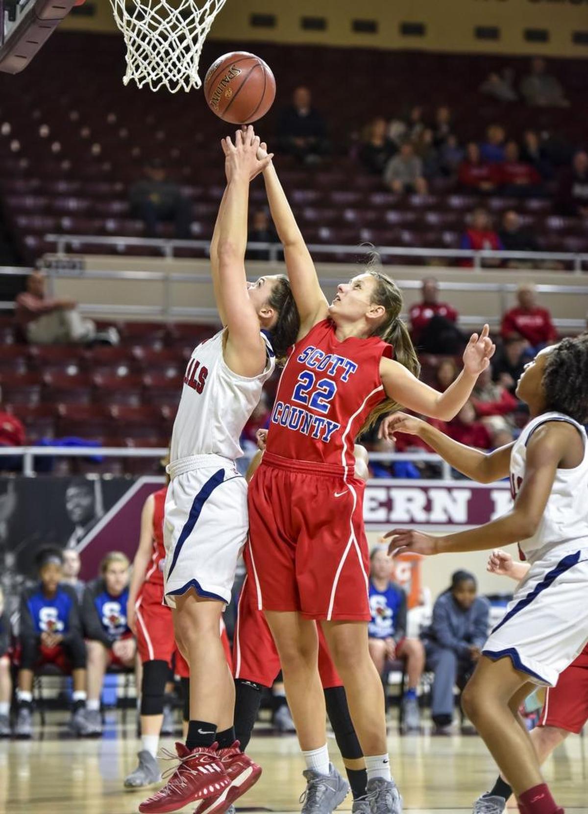 Scott County's Peyton Riddle (22) fights for a rebound with Lafayette's Caroline Bennett (5), during the girls 11th Region Tournament semifinals, Friday night, March 3, 2017, at EKU's McBrayer Arena in Richmond.